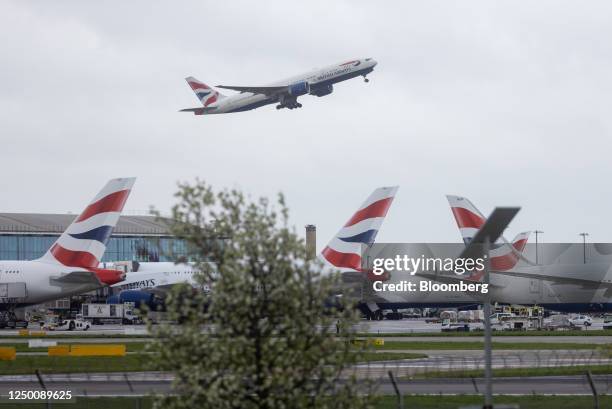 Passenger airplane, operated by British Airways, takes off from London Heathrow Airport in London, UK, on Friday, March 31, 2023. British Airways is...