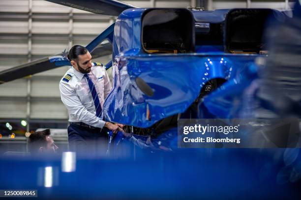 Pilot performs a pre-flight check on a helicopter at the Helijet hanger at Vancouver International Airport in Richmond, British Columbia, Canada, on...