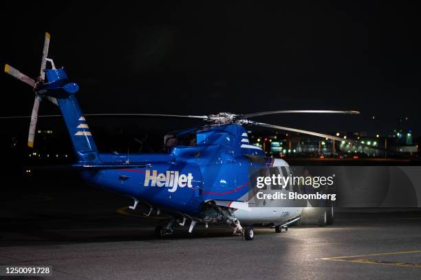 Grounds grew roll out a Helijet helicopter from the hanger at Vancouver International Airport in Richmond, British Columbia, Canada, on Thursday,...