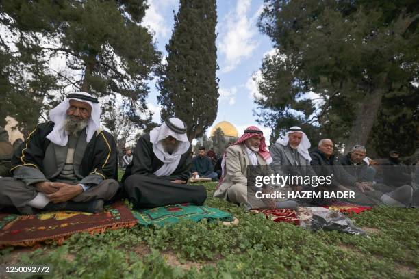 Palestinians perform the second Friday prayer of the Muslim holy fasting month of Ramadan in front of the Dome of the Rock mosque at the al-Aqsa...