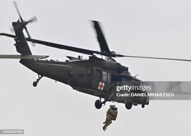 Medevac Black Hawk helicopter flies during a demonstration as part of the rotation of US troops of the US Army 101 Airborne division at Mihail...