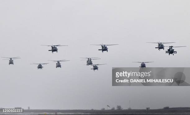 Different types of helicopters, among them Chinook, Black Hawk and Apache, fly during the final display formation as part of the rotation of US...