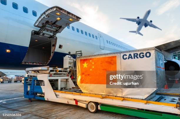 loading the container in the cargo airplane. - cargo airplane stock pictures, royalty-free photos & images