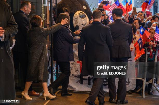 Taiwan's President Tsai Ing-wen waves to supporters as she departs from a hotel in New York City on March 31, 2023.