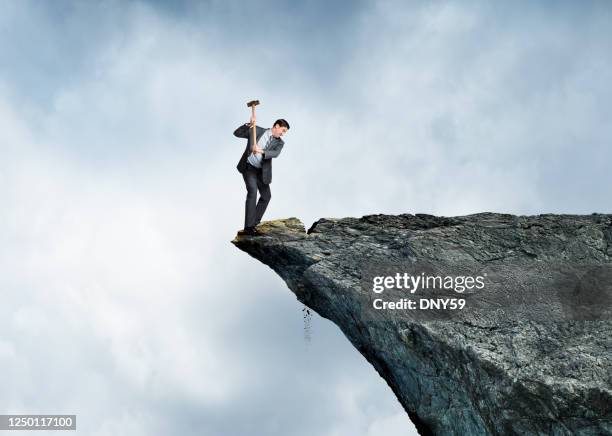 businessman on wrong side - sledgehammer stock pictures, royalty-free photos & images