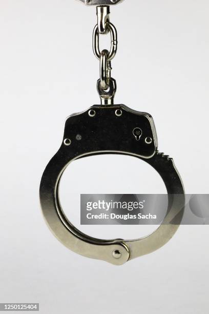 handcuffs used by law enforcement - handboeien stockfoto's en -beelden
