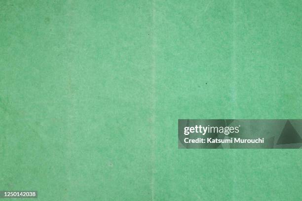old creased green color paper texture background - papier kraft photos et images de collection