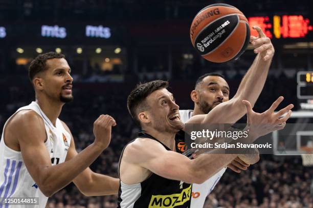 Aleksa Avramovic of Partizan in action against Petr Cornelie and Adam Hanga of Real Madrid during the 2022-23 Turkish Airlines EuroLeague Regular...