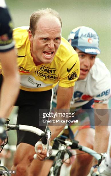 Bjarne Riis of Denmark who finished first overall climbing with Abraham Olano of Spain who is second overall behind him during Stage Thirteen of the...