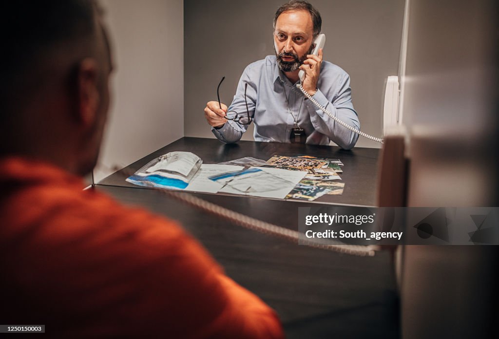 Interviewing Inmate Inmate Talking With Detective In Prison Visit Room High-Res Stock Photo ...