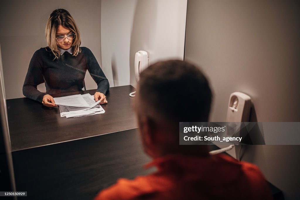 Interviewing Inmate Male Inmate Talking With His Lawyer In Prison Visit Room High-Res Stock ...