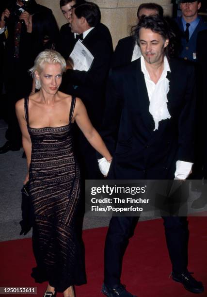 Bob Geldof, singer, songwriter and political activist, with his wife, television presenter and writer Paula Yates , at the Royal Gala premiere of...