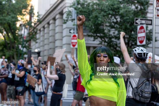 Singer Mila Jam poses raising her fist at a Black Lives Matter Protest near the Stonewall Inn on June 16, 2020 in New York City.
