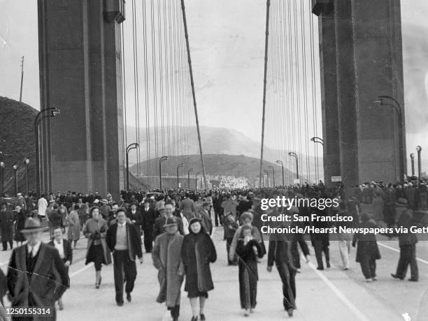 Walkers take advantage of Pedestrians Day, the first of two opening days for the Golden Gate Bridge, May 27, 1937. Photo ran May 28, 1937.