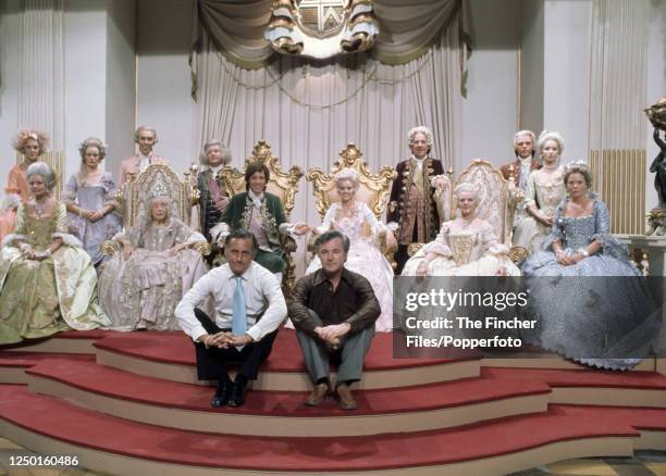 The cast of the British musical film "The Slipper and the Rose: The Story of Cinderella" with producer Stuart Lyons and director Bryan Forbes at...