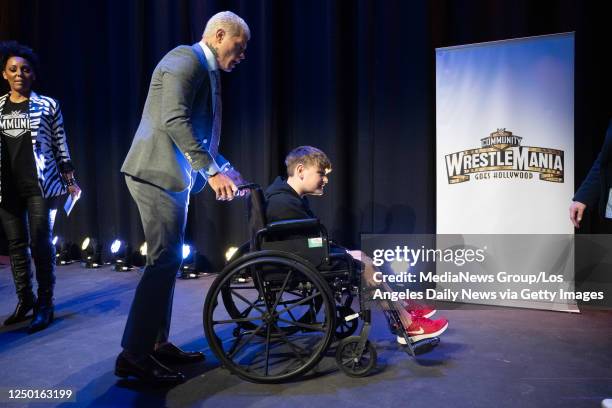 Universal City, CA WWE Superstar Cody Rhodes gives Make-A-Wish kid Logan Lewis some help getting off the stage during an event for 20 Make-A-Wish...