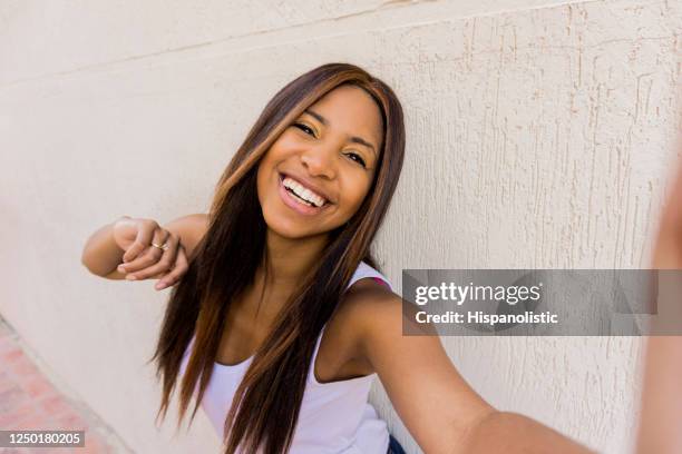 happy woman taking a selfie with her engagement ring - black women engagement rings stock pictures, royalty-free photos & images