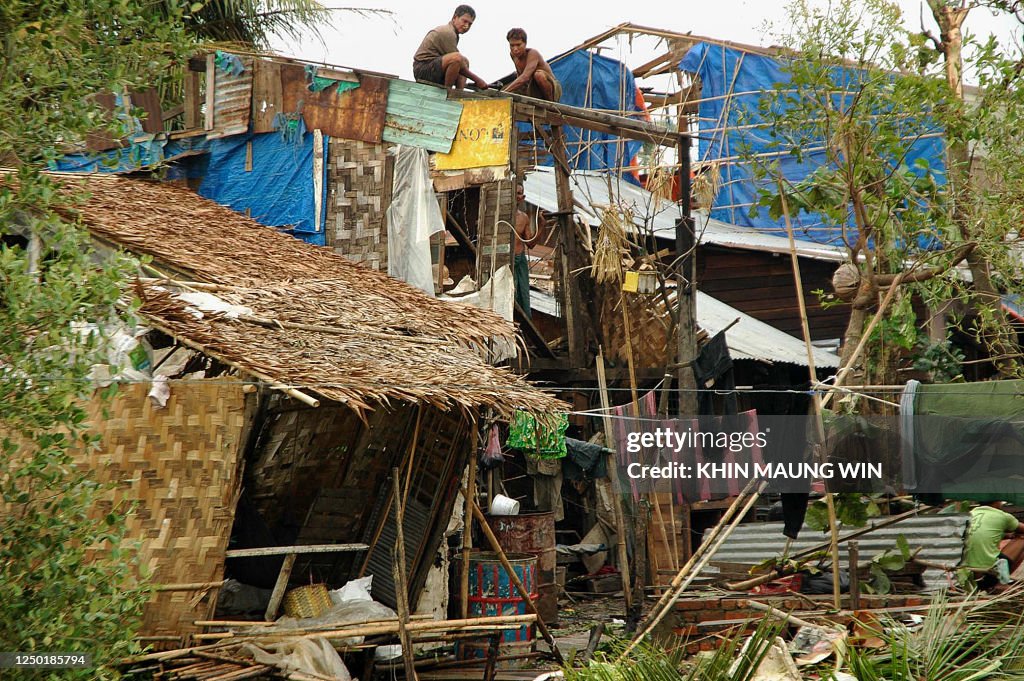 Nargas Rica Residents rebuild their house after cyclone Nargis on the outskirts ...