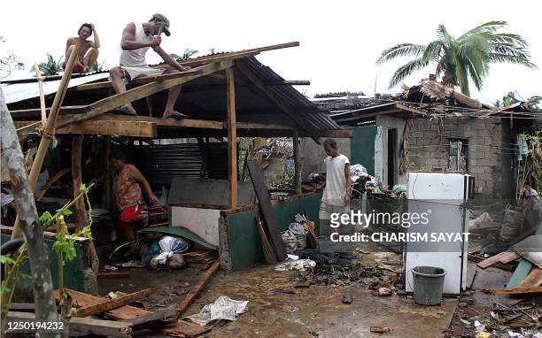 Villagers rebuild their destroyed houses in Juban town in Sorsogon province, 04 October 2006, after Typhoon Xangsane pounded the southeren Luzon...