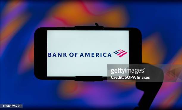 In this photo illustration, the Bank of America logo is seen displayed on a mobile phone screen.