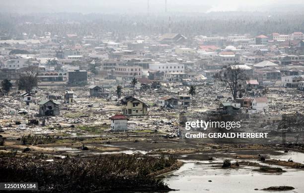 View of the devastated town of Lampuuk from the helicopter transporting Former US Presidents George H.W Bush and Bill Clinton over the Aceh province,...