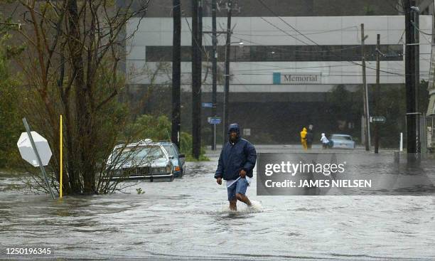 Man wades through high water 29 August 2005 in New Orleans, after Hurricane Katrina made landfall near the Louisiana metroplis. Hurricane Katrina...