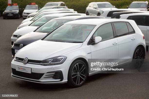 volkswagen golf at dealership - volkswagen golf gti stock pictures, royalty-free photos & images