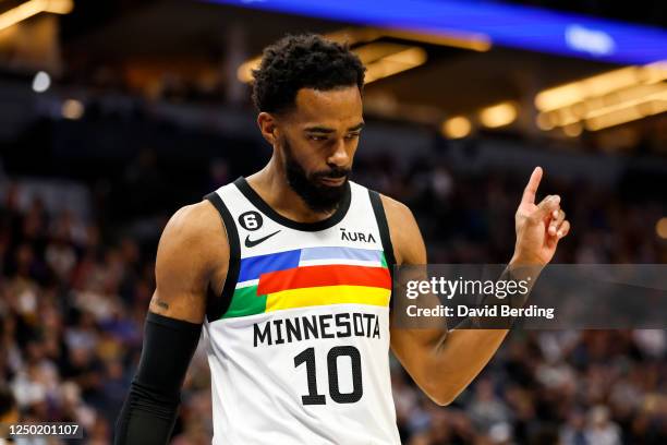 Mike Conley of the Minnesota Timberwolves celebrates a turnover by the Los Angeles Lakers in the first quarter of the game at Target Center on March...