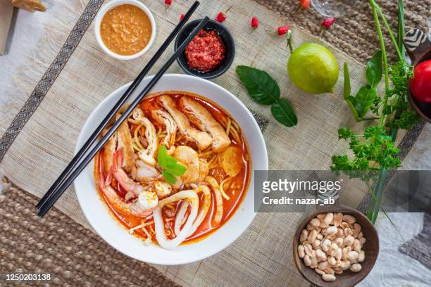 seafood curry laksa. - traditional malay food stock pictures, royalty-free photos & images