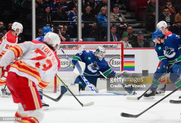 Thatcher Demko of the Vancouver Canucks makes a save during the first period of their NHL game against the Calgary Flames at Rogers Arena March 31,...