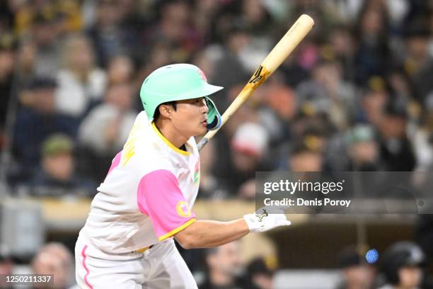 Ha-Seong Kim of the San Diego Padres hits a double during the fifth inning of a baseball game against the Colorado Rockies at Petco Park on March 31,...