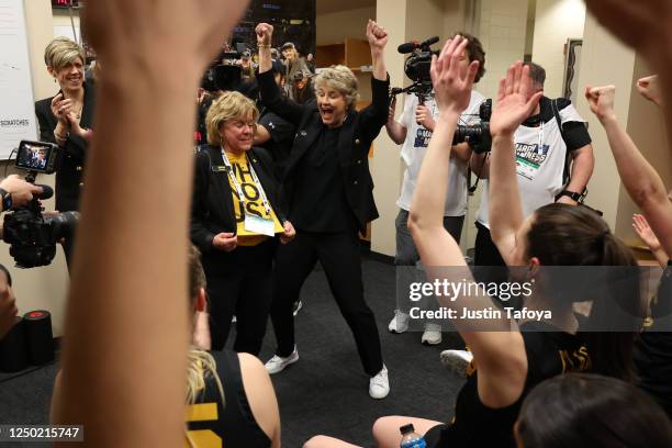 Iowa Hawkeyes players celebrate their win over the South Carolina Gamecocks during the semifinals of the NCAA Women's Basketball Tournament Final...