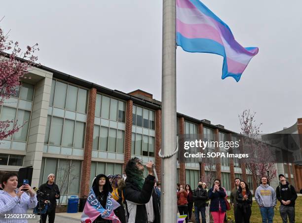 Claire Wynne raises the Transgender Flag during a Transgender Day of Visibility program. March 31, is the Transgender Day of Visibility a day meant...