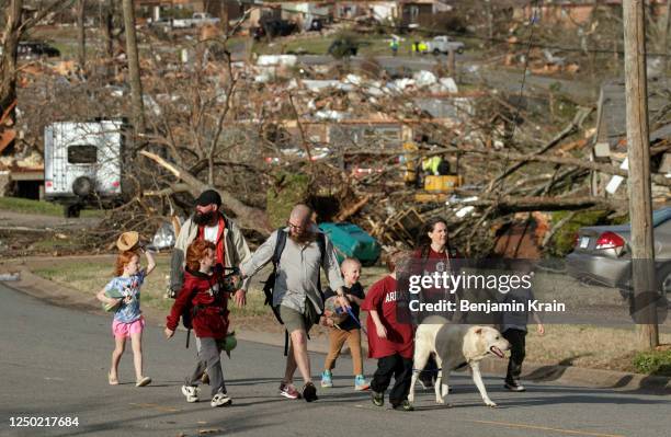 Family evacuates their Walnut Ridge neighborhood on March 31, 2023 in Little Rock, Arkansas. Tornados damaged hundreds of homes and buildings Friday...