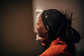 Female prisoner talking on phone in prison visit room