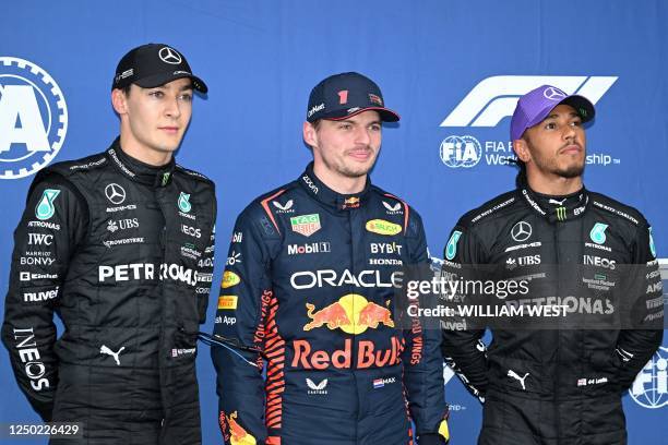 Pole position qualifier Red Bull Racing's Dutch driver Max Verstappen poses with second qualifying positioned Mercedes' British driver George Russell...