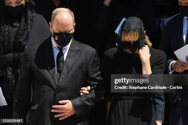 Melanie Antoinette de Massy, Prince Albert II of Monaco and Princess Charlene of Monaco leave the Monaco Cathedral after Elizabeth-Ann De Massy's...