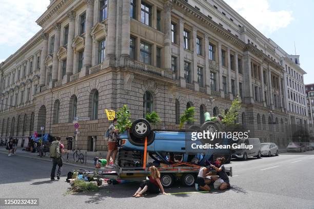 Supporters of the Extinction Rebellion climate change protest movement blockade the intersection in front of the German Association of the Automotive...