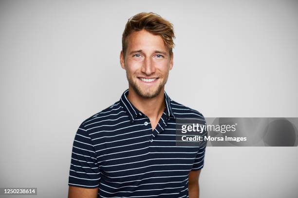close-up portrait of smiling young man. - german culture stock pictures, royalty-free photos & images