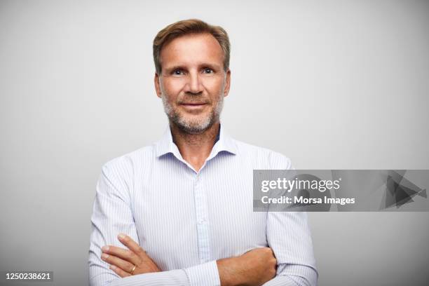 handsome mature businessman with stubble. - business people on white background stock pictures, royalty-free photos & images