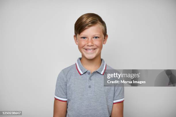 portrait of cute boy smiling on white background. - boy white background stock-fotos und bilder