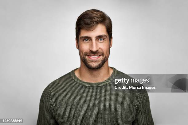 portrait of handsome smiling man in casuals - adulto de mediana edad fotografías e imágenes de stock