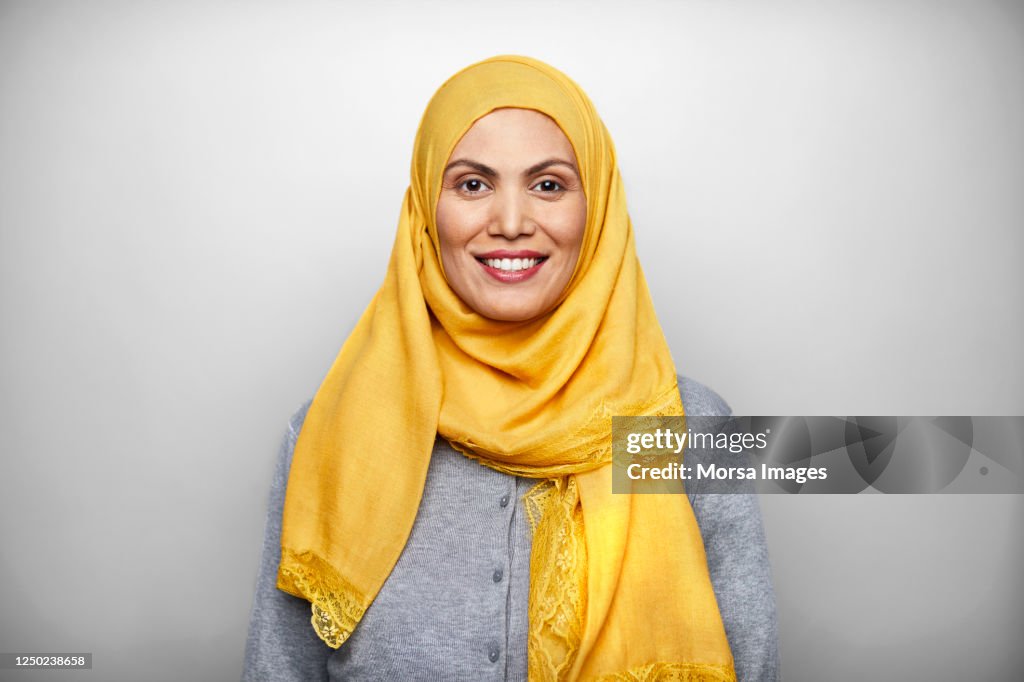 Portrait of Smiling Mid Adult Woman Wearing Hijab.