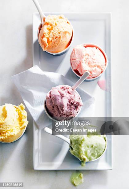 5 flavors of ice cream in cups - fruit sorbet stock pictures, royalty-free photos & images