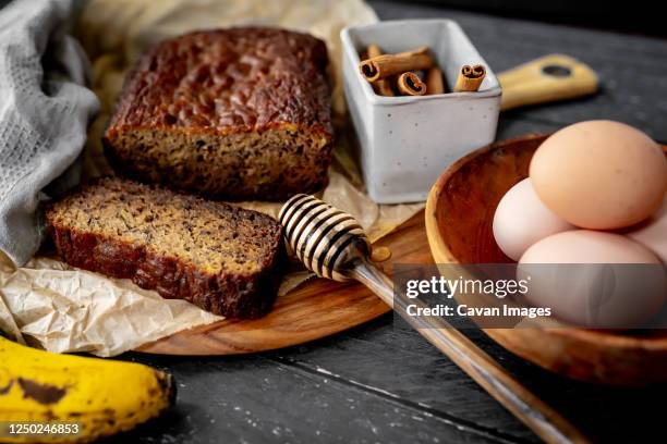 home made banana bread rustic flat lay fresh ingredients honey eggs - banana loaf stock pictures, royalty-free photos & images