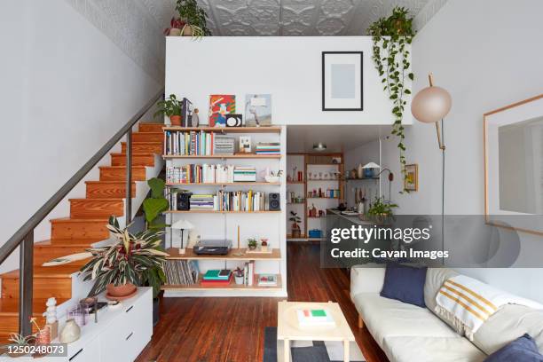 interior of loft apartment livingroom, stairs, and kitchen - apartamento tipo loft imagens e fotografias de stock