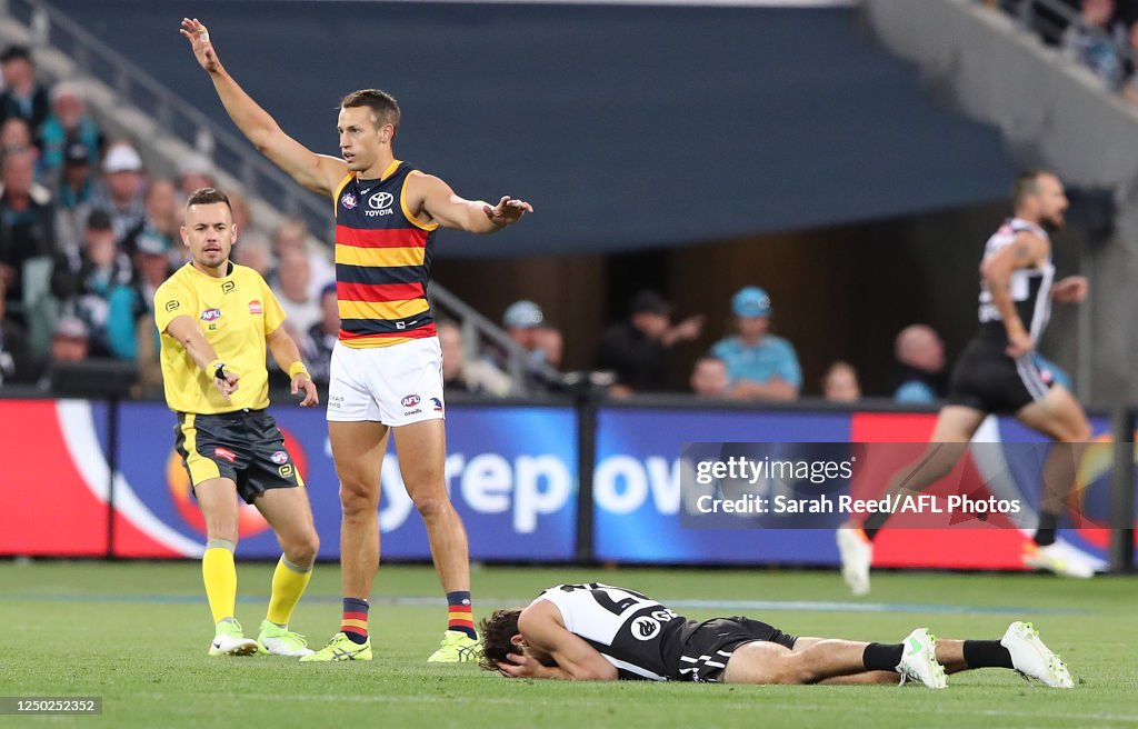 Connor Rozee Crows Connor Rozee of the Power down after a bump from Tom Doedee of the ...
