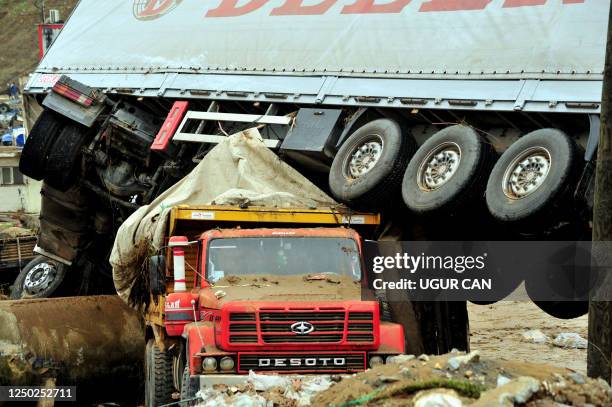 Flood-damaged vehicles are piled up on September 9, 2009 in Istanbul. At least 14 people were killed as heavy overnight rains flooded parts of...
