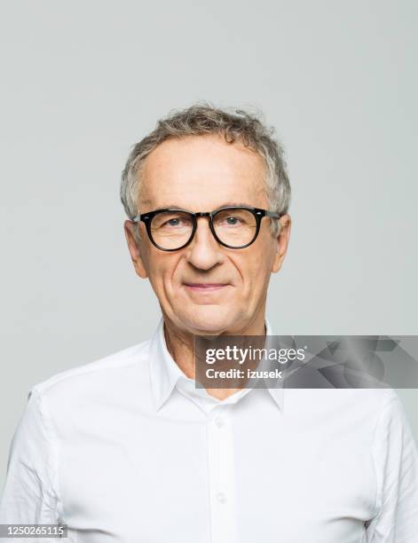 headshot of friendly senior businessman - old wise business man white stock pictures, royalty-free photos & images