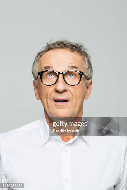 headshot of surprised senior businessman - old wise business man white stock pictures, royalty-free photos & images